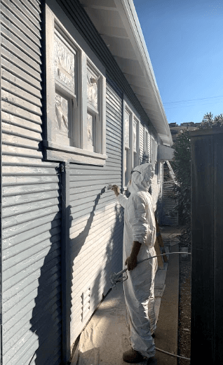 Exterior painting in progress on residential property