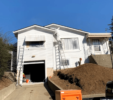 Siding being stripped and readied for new paint
